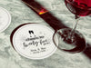 A single coaster with a wine glass on top of it with a coaster off to the side. Coasters shown are customizable. Coasters are designed with gray sparkly elements, wine glasses, and the words Cheers to twenty-five years, custom names, and custom date.