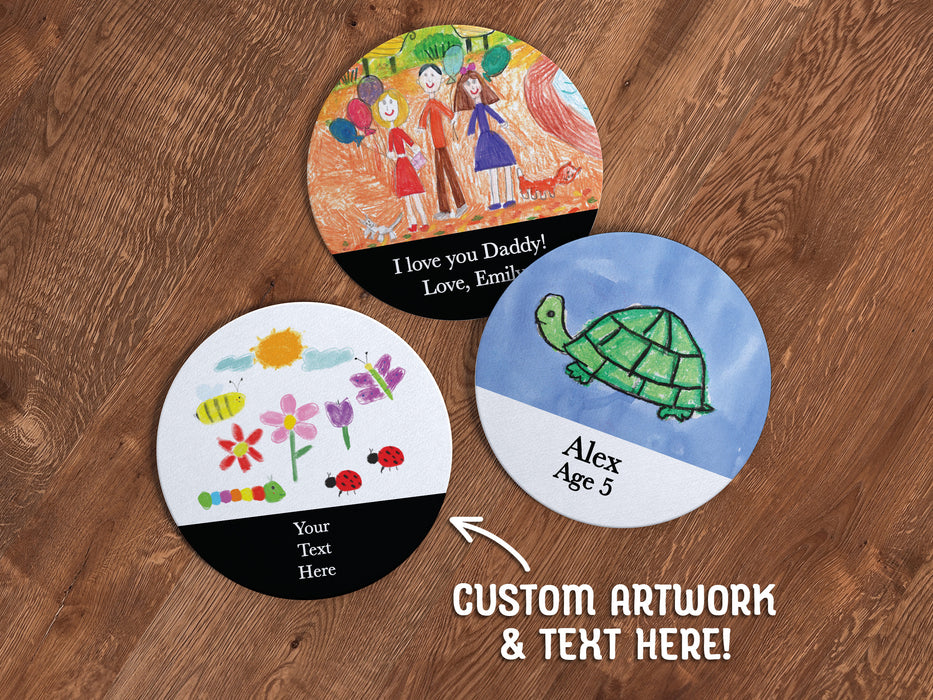 three round paper coasters with kids artwork and custom text printed on the coasters on a wooden table
text says Custom Artwork & Text Here!