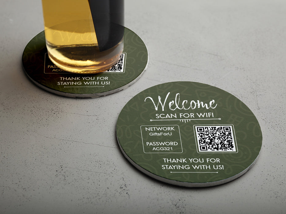 two custom round QR code coasters that offer free wifi and the wifi password on a white table with a glass bottle of beer